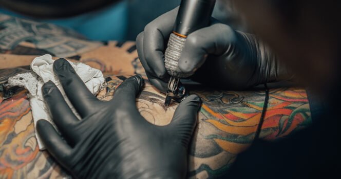 Dad removes full-body tattoos for sake of his young daughter